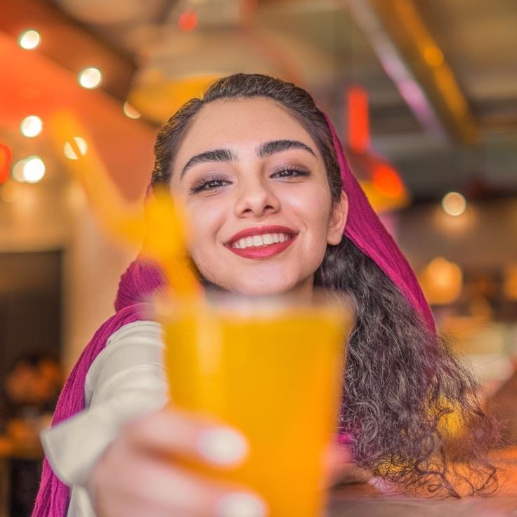 Kaveri Mehta, Lead Design Curator at Clean Route Haven, reviewing corporate floral arrangements